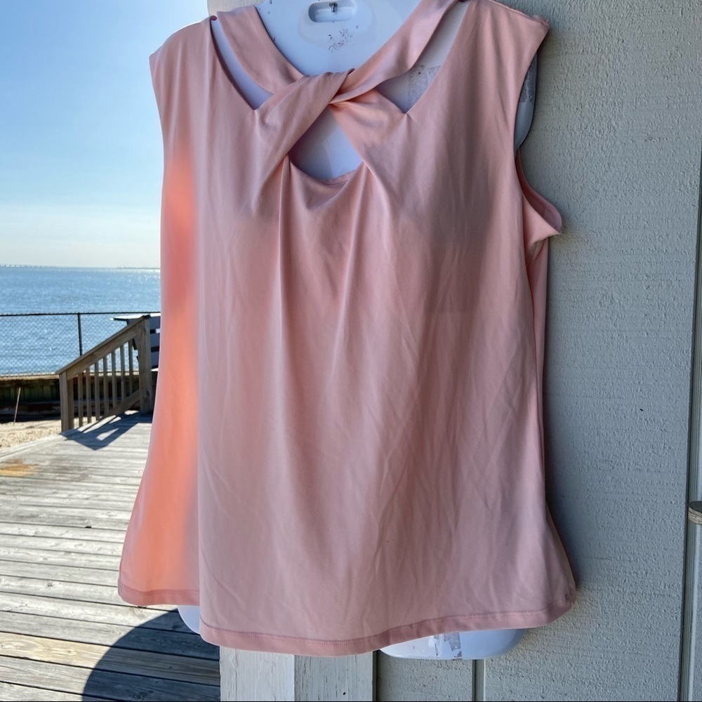 Attention soft peach and cream sleeveless top with feminine detail front collar.
